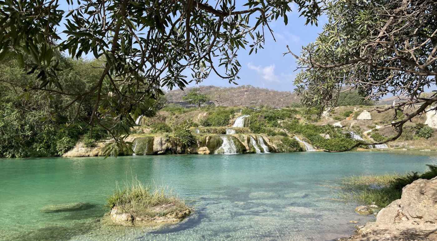 Turquoise pool and waterfalls in a Dhofar wadi, Oman | nomad
