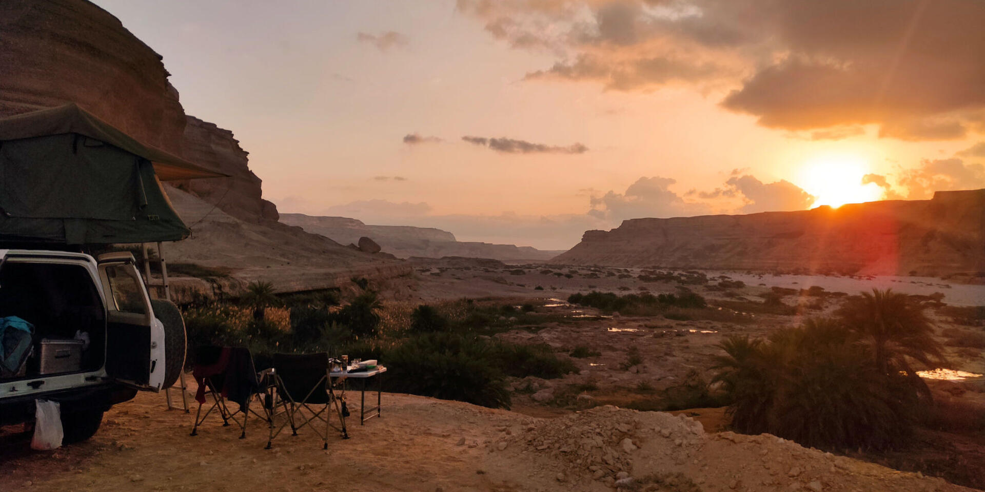 Rooftop tent camp at sunset in Wadi Shuwaymiyah during an Oman 4WD self-drive road trip | Oman