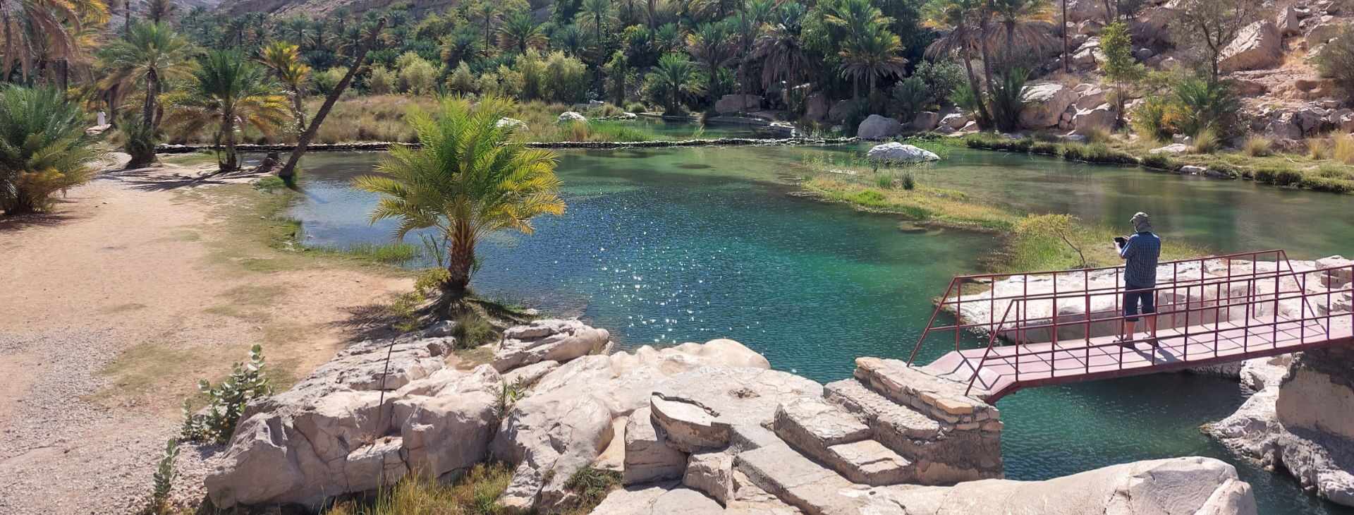 Turquoise pool and footbridge at Wadi Bani Khalid, Oman | nomad